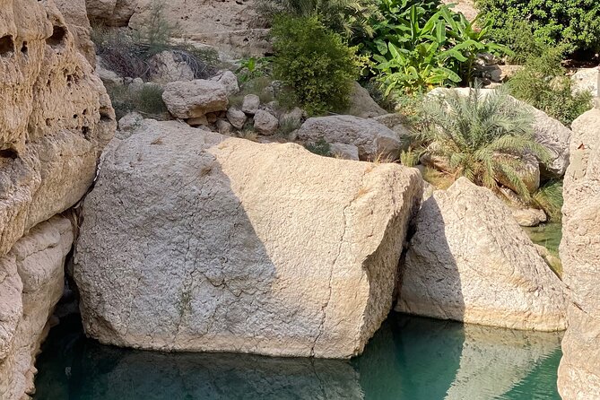 Discover Wadi Shab by a Professional Omani Guide (private). - Crossing the river into Wadi Shab