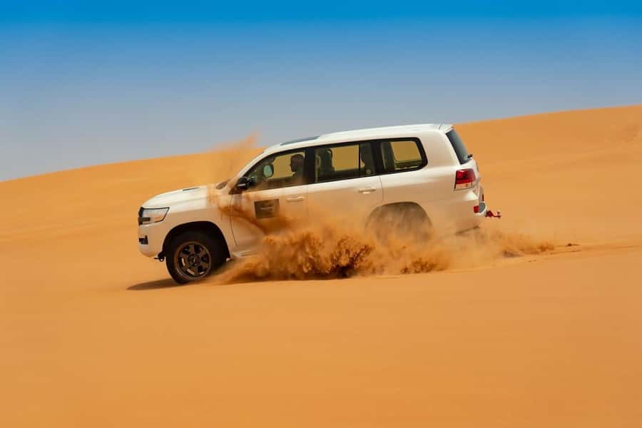 Dubai: Desert Safari with BBQ Dinner - Sunset over the red dunes