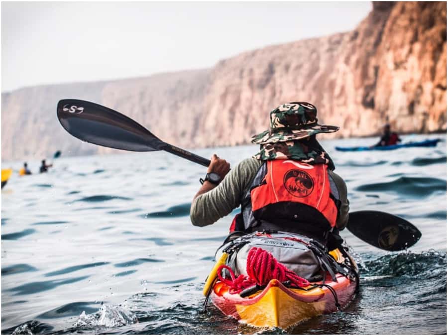 From Muscat: Al Qurum Beach Sunset Kayaking Experience - Launching into the calm water