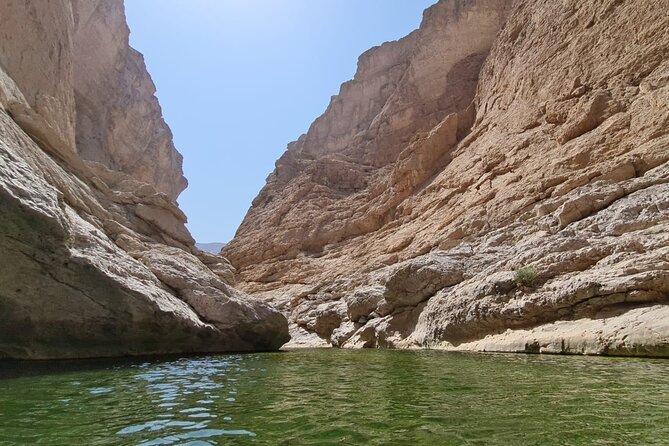 Full-Day Bimmah Sinkhole and Wadi Al Arbeieen Tour - Fins Beach adds sun, sand, and open space