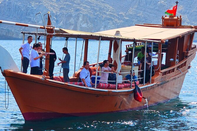 Full day Dhow: Khasab, Musandam: Dolphins, Snorkeling & Fjords - Dolphin watching at the start of the morning