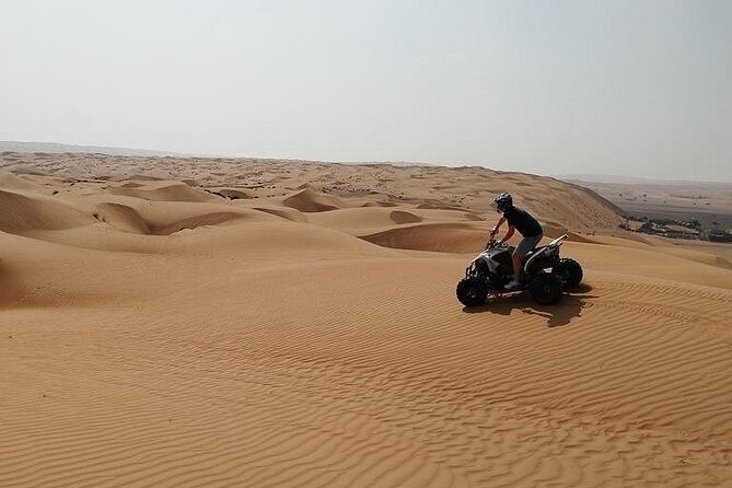 Full-Day Private Experience through Desert Adventure in Oman - Quad biking across the orange sand