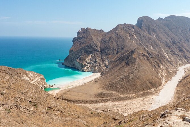 Full-Day Private Salalah West Tour with Lunch - Mughsail Beach, palms, and mountain walls