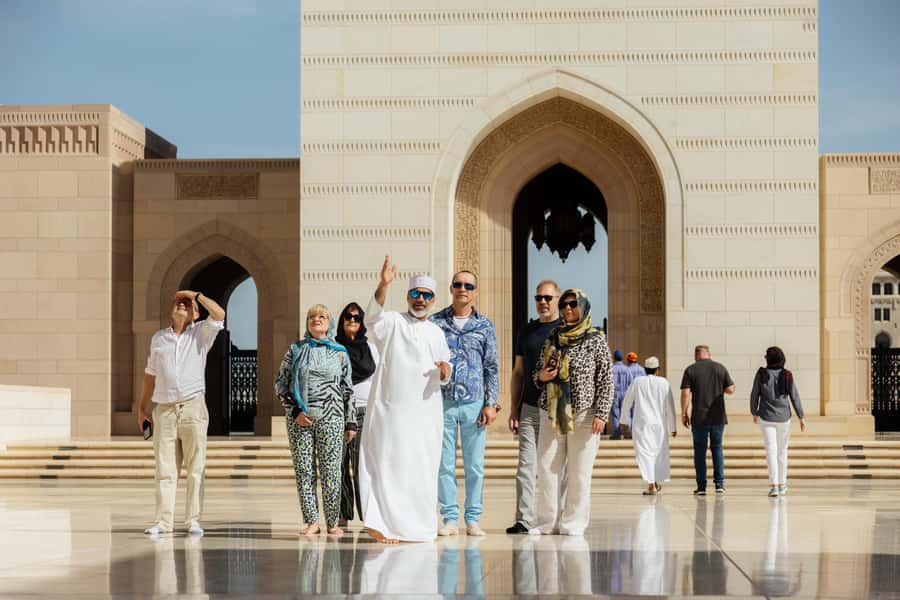 Guided Walking Tour of Sultan Qaboos Grand Mosque in Muscat - Open-air corridors, gardens, and reflecting pools