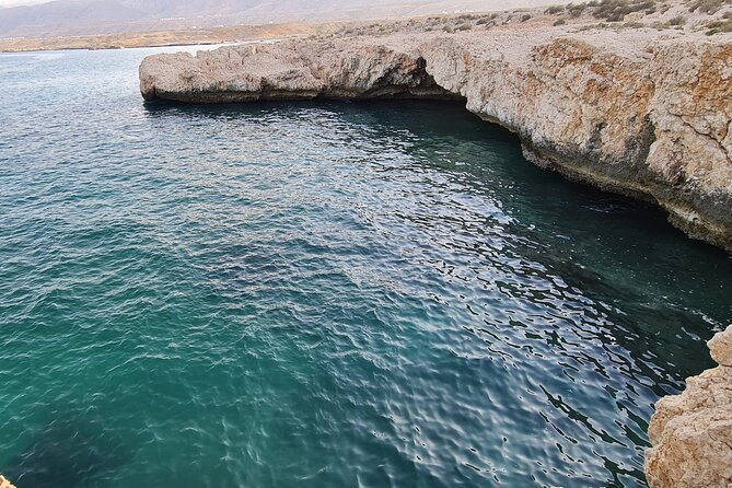 Hidden Gems of Oman: Sinkhole, Fins Beach & Wadi Tiwi Adventure - Bimmah Sinkhole and its sea-colored water