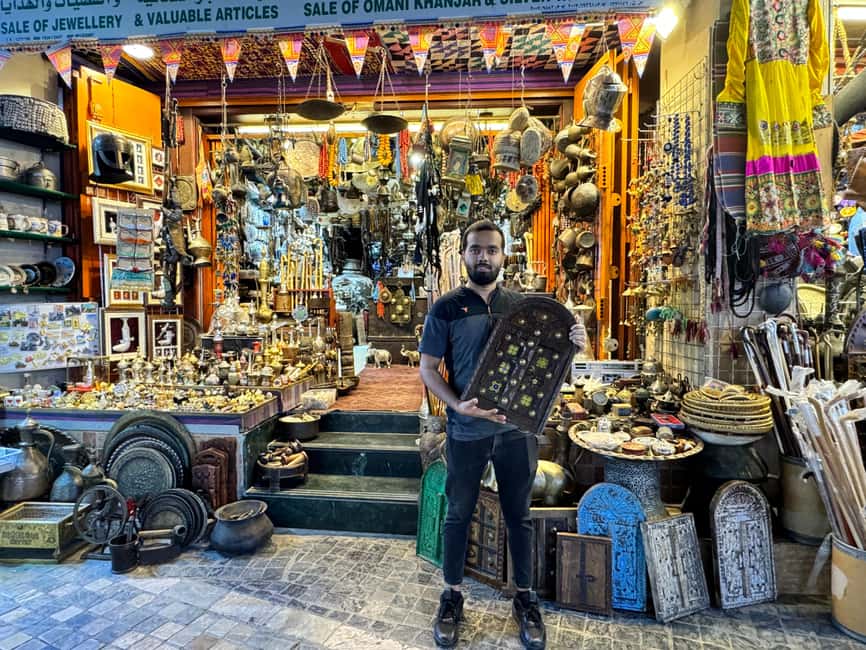 Muscat: Guided Walking Tour of Corniche, Souq & Mutrah Fort - Reading Mutrah Souq beyond the shopfronts