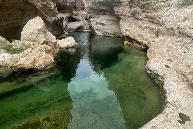Private Day Trip to Wadi Shab, Fins Beach & Bimmah Sinkhole - Swimming through the clear pools and cave
