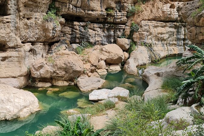 Private Full-Day Wadi Tiwi and Bimmah Sinkhole Tour from Muscat - Bimmah Sinkhole and its small blue-green lake