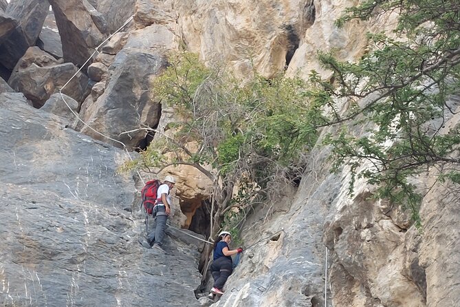 Shared Guided Canyoneering Experience in Snake Canyon of Oman - Swimming under waterfalls in cold canyon water