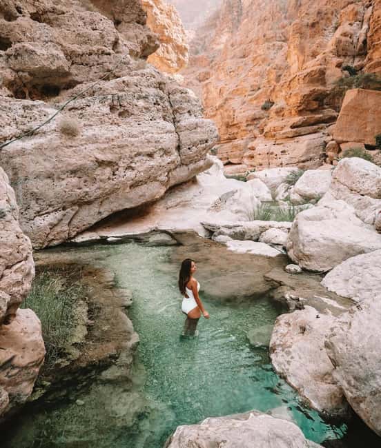 wadi shab and bimmah sinkhole tour from muscat - The small boat ride adds a slower moment